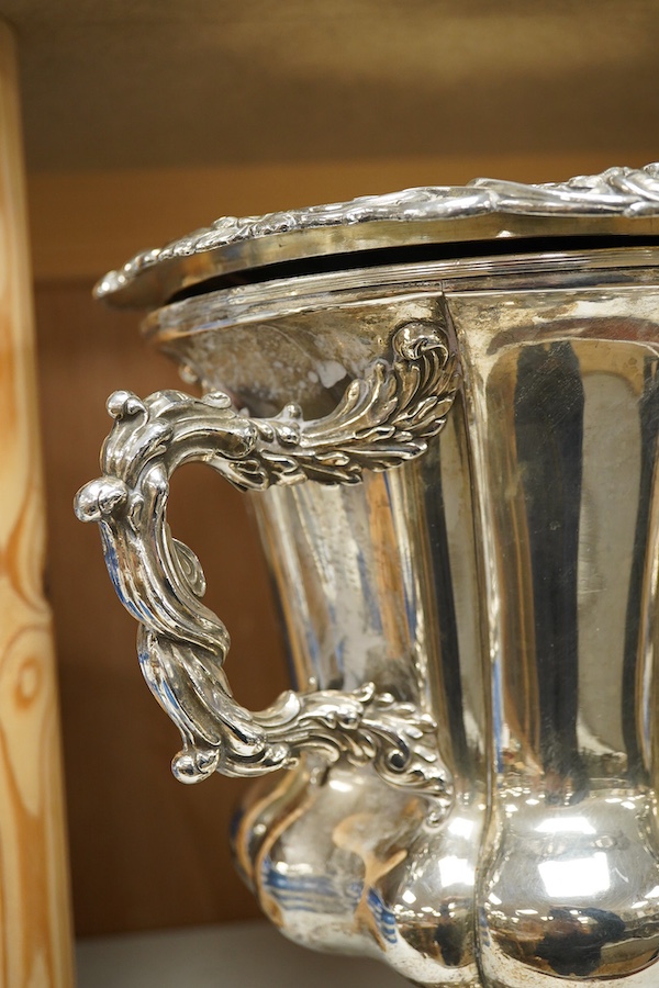 A pair of Old Sheffield plate two handled plated wine coolers, with later associated liners, 26cm high. Condition - fair